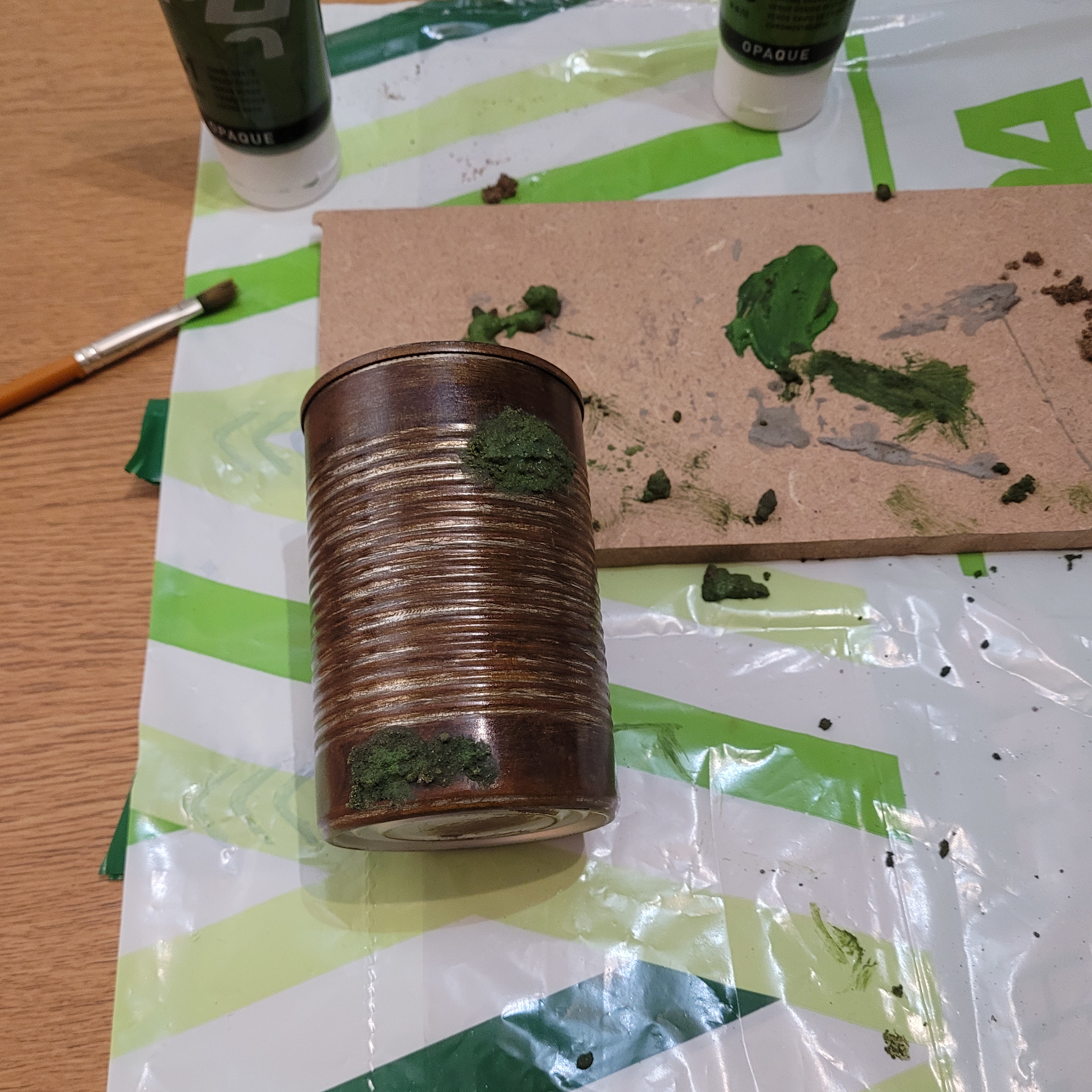 Rusted penpot being painted with mold